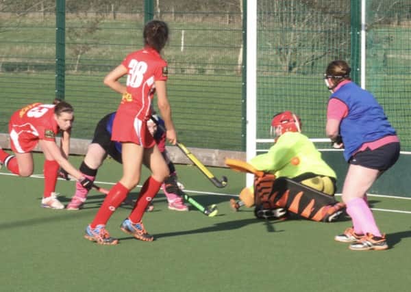 Garstang Hockey Club's Steph Roe comes close to scoring with Alice Noble in close support