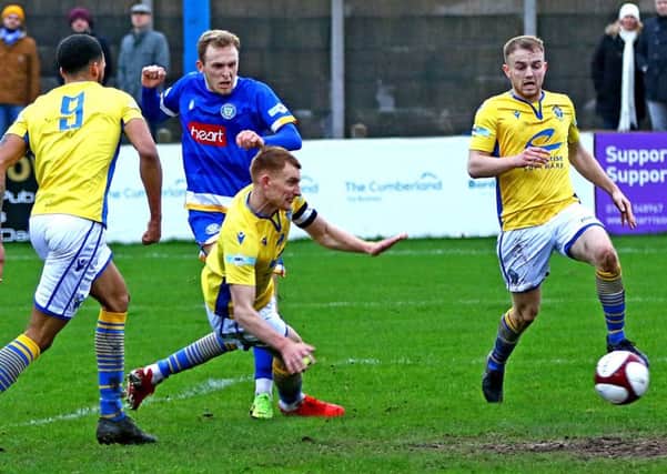 Charlie Bailey blasts in Lancaster City's first. Picture: Tony North
