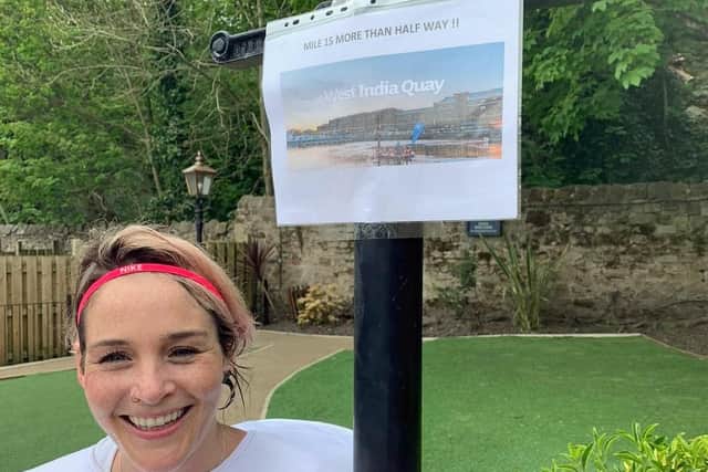 Kellie Clark wasn't going to let the lockdown get in the way of her marathon for Round Table Children's Wish - she ran the full 26.2 miles in her pub garden with helpful reminders of the London course made by husband Alasdair.