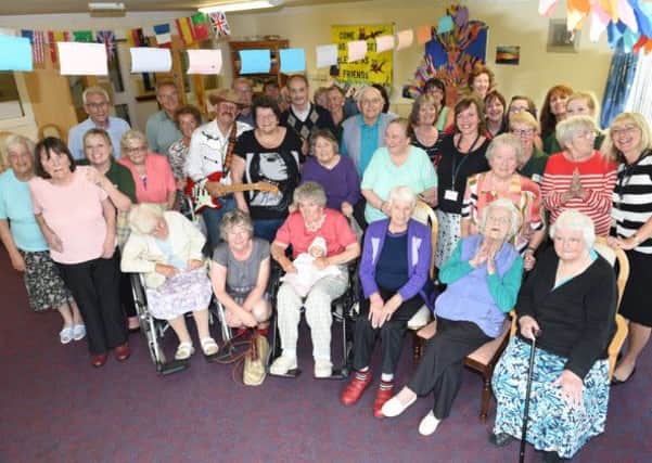 A cream tea afternoon at Altham Meadows day centre in Morecambe has raised £200. Pictured are service users, staff and country and western entertainer Billy Blundell at the cream tea afternoon. Altham Meadows was not affected by the closure of the NHS continuing care unit in the same building in March.