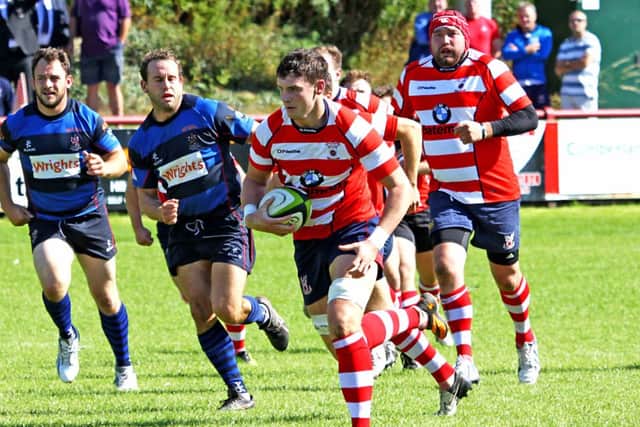 Sam Wallbank charges forward for the Vale of Lune against Stoke.