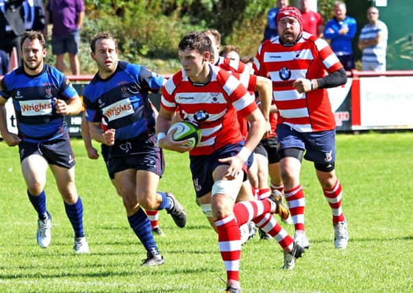 Sam Wallbank charges forward for the Vale of Lune against Stoke.