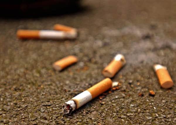 Undated handout photo of cigarette butts in the street. Britain's streets could become even more littered because of Government plans for a smoking ban in public places, according to a survey out Monday February 7, 2005. The Industry Council for Packaging and the Environment (INCPEN), commissioned the charity ENCAMS, which runs the Keep Britain Tidy campaign, to carry out a survey into the volume of litter and an analysis of its constituent parts. See PA story ENVIRONMENT Litter. PRESS ASSOCIATION Photo. Photo credit should read: Ken Lennox/PA