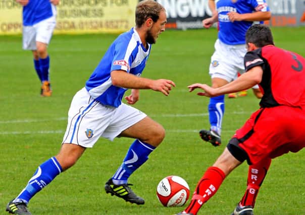 Sam Bailey on the ball for Lancaster City against Bamber Bridge. Picture: Tony North