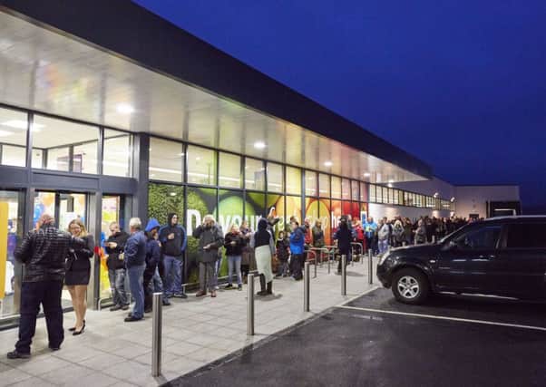 Aldi Carnforth grand opening 
Pictured 200 people queue to win a golden ticket