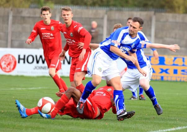 Garry Hunter battles for the ball against Radcliffe Borough. Picture: Peter Gray