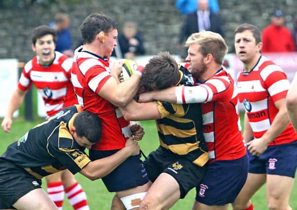 Sam Wallbank and Ben Dorrington battle for the ball for the Vale of Lune at Kendal. Picture: Tony North