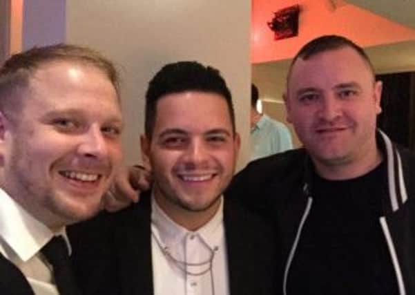 A happy Paul Akister (centre) getting over his X Factor rejection back home in Lancaster with friends Stuart Michaels and Matt Thistlethwaite.