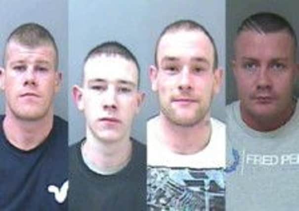 Four men have been jailed after attacking a man with a toilet cistern in his own home.