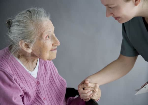 carer elderly old care nurse pensioner helping aged
