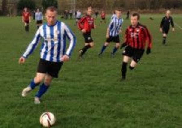 Action from the game between Bentham and Trimpell & Bare Rangers.