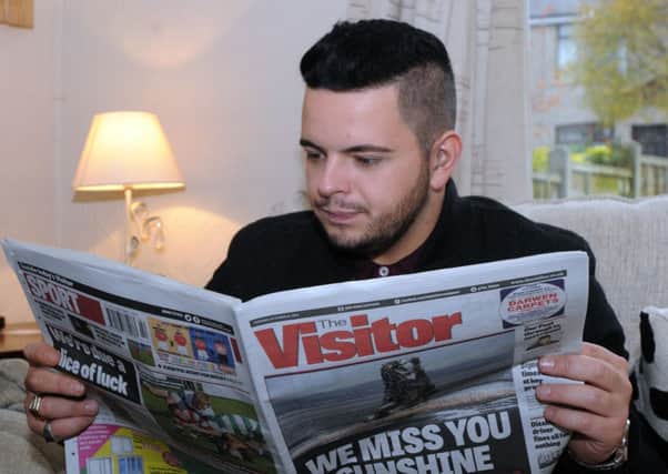 Photo: David Hurst - Paul Akister familiarises himself with The Visitor newspaper!