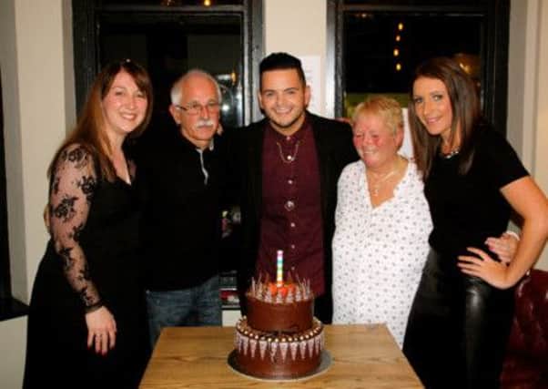 Paul with Louise Welfare from Emma's Tea Parties Ltd who supplied the cake, dad Dave, mum Bev and sister Charlotte.