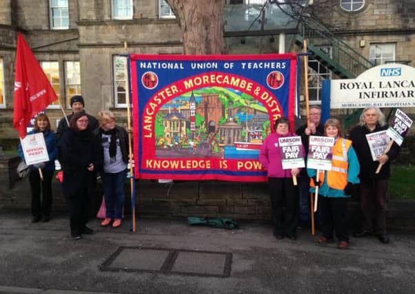 NHS workers and Unison members strike over pay outside Royal Lancaster Infirmary.