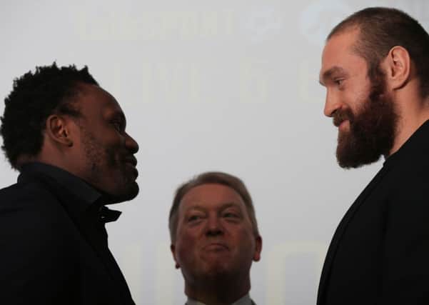 Boxing Promoter Frank Warren with Dereck Chisora (left) and Tyson Fury (right) during the head to head press conference at the Imperial War Museum, London. Photo: Nick Potts/PA Wire