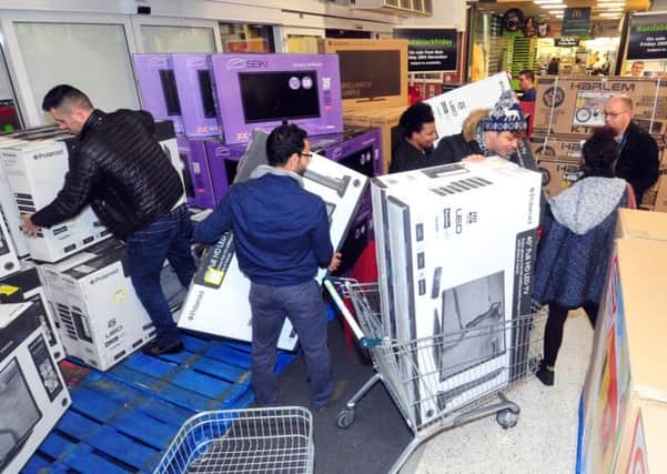 Shoppers grab bargain TV's on offer on Black Friday. Picture by Tony Johnson