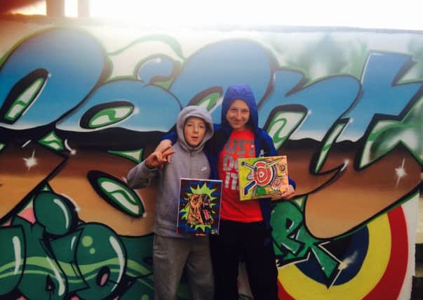 Callum James and Jordan Gardner with some of the canvases that have inspired the graffiti wall.