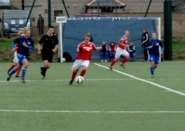 Megan Doherty drives forward for Morecambe Ladies against Middlesbrough.