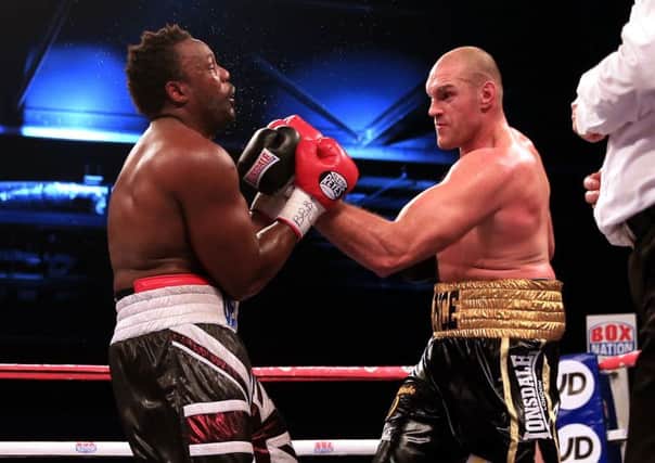 Tyson Fury (right) in action against Dereck Chisora. Picture: Nick Potts/PA Wire.