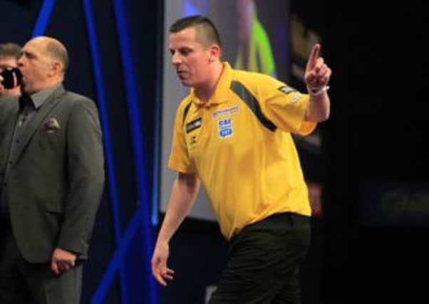Dave Chisnall is through to the next round of the William Hill World Darts Championship after beating Ryan de Vree. 
PIC;Lawrence Lustig.