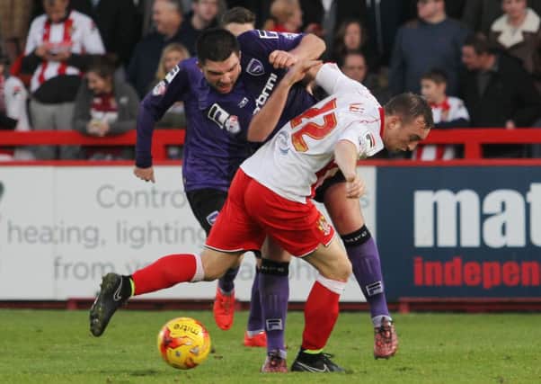 Alex Kenyon and Charlie Lee tussle during the game at Stevenage in November. Picture: The Comet