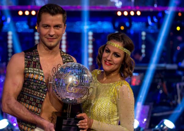 Pasha Kovalev and Caroline Flack crowned winners of Strictly Come Dancing 2014

For use in UK, Ireland or Benelux countries only
BBC handout photo of Pasha Kovalev and Caroline Flack who are the winners of Strictly Come Dancing 2014. Issue date: Saturday December 20, 2014. See PA story SHOWZBIZ Strictly. Photo credit should read: Guy Levy/BBC/PA Wire 

NOTE TO EDITORS: Not for use more than 21 days after issue. You may use this picture without charge only for the purpose of publicising or reporting on current BBC programming, personnel or other BBC output or activity within 21 days of issue. Any use after that time MUST be cleared through BBC Picture Publicity. Please credit the image to the BBC and any named photographer or independent programme maker, as described in the caption.