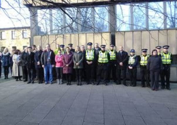 Police in Lancaster hold a two minute silence.