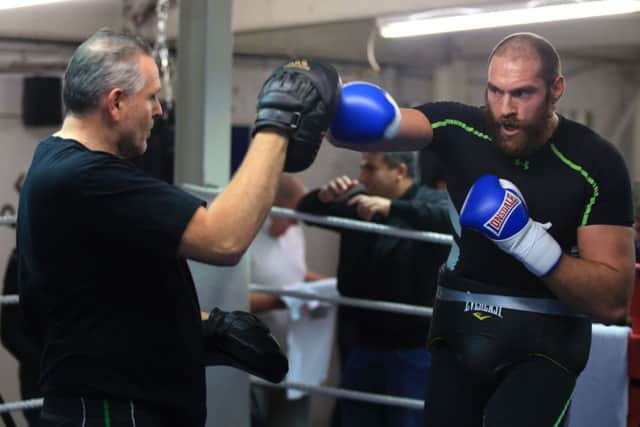 Heavyweight boxer Tyson Fury with trainer, and uncle, Peter Fury. Picture:  Nick Potts/PA Wire