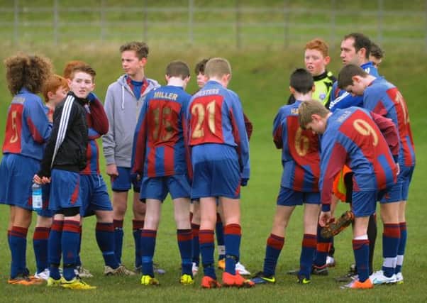 Coach Jeremy Simpson gives the team talk. Picture: Rob Lock