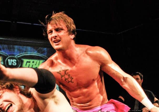 Kris Travis shown during a wrestling match at Lancaster and Morecambe College in 2012.