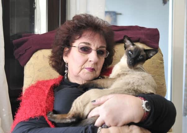 Judy Grundey at home with her cat 'Sultan'