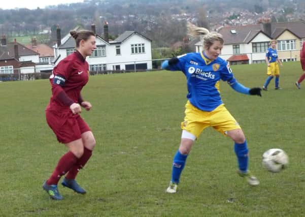 Morecambe Ladies' Sophie Fish on the ball at Mossley Hill.