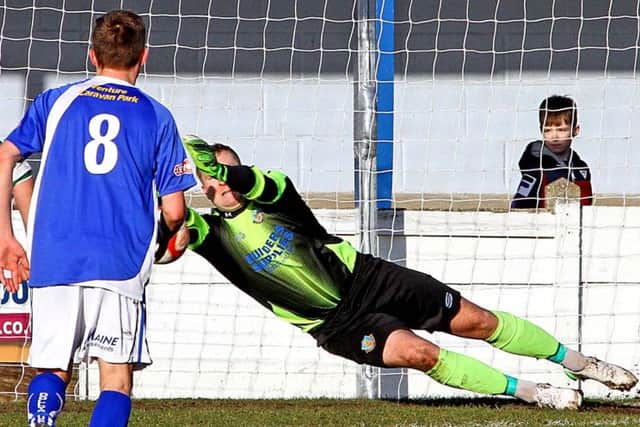Mike Hale saves a penalty for the Dolly Blues against Northwich. Picture: Tony North