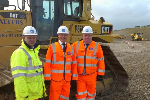 Andrew Langley, project director for Costain, David Morris, MP for Morecambe and Lunesdale, and Patrick McLoughlin, Secretary of State for Transport, at the Heysham to M6 link road site base in Halton on Thursday.