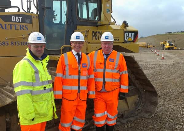 Andrew Langley, project director for Costain, David Morris, MP for Morecambe and Lunesdale, and Patrick McLoughlin, Secretary of State for Transport, at the Heysham to M6 link road site base in Halton on Thursday.