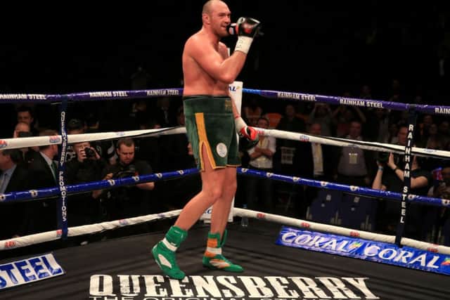 Tyson Fury sings his own version of Walking in Memphis to the crowd after beating Christian Hammer. Picture: Nick Potts/PA Wire