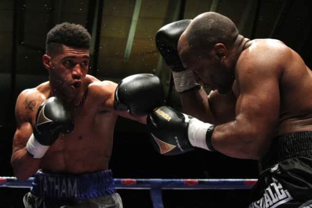 Tomi Tatham in action against Elvis Dube. Picture: Paul Simpson