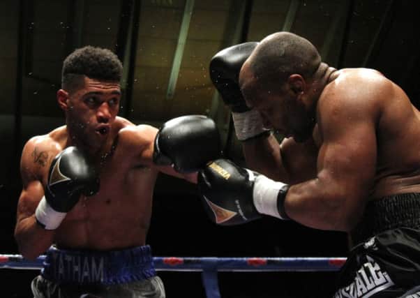 Tomi Tatham in action against Elvis Dube. Picture: Paul Simpson