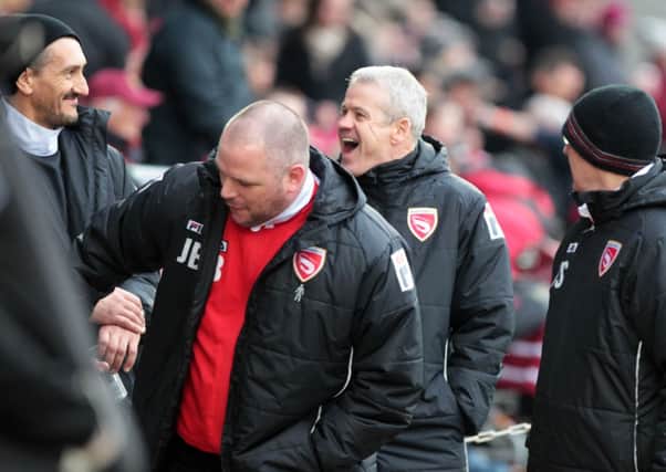 Ken McKenna and Jim Bentley share a joke with the Morecambe staff.
