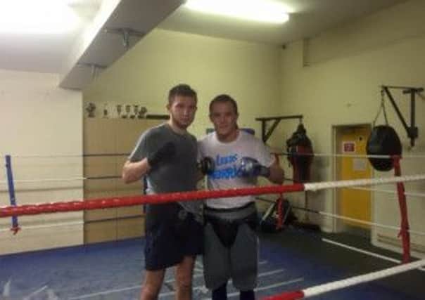 Isaac Lowe, left, after sparring with Josh Warrington.