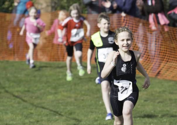 Nine-year-old City of Lancaster Triathlon athlete Olivia Goddard starting the run phase at the Wirral Aquathlon.