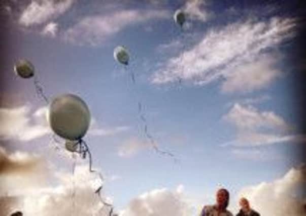 Balloons are released after the Force 5 challenge to raise money for George's Telescope Appeal.