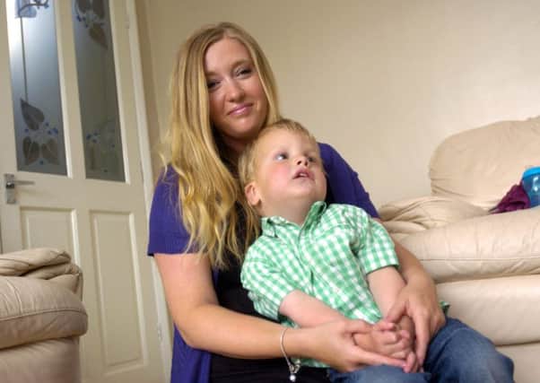 Sarah Alderson with her son Elliot Swindell, who has set up a chat group for parents with autistic children.