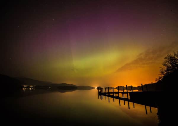 The northern lights as they are commonly known, over Derwent water near Keswick in the Lake District. Picture : Owen Humphreys/PA Wire