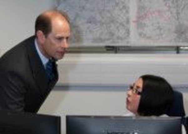 Prince Edward, Earl of Wessex meets a member of staff at Lancashire Constabulary's force control room.