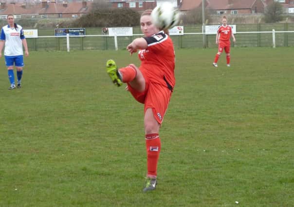 Morecambe Ladies' Becky Whittingham hooks the ball forwards against Tranmere.