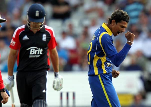 Sri Lanka's Suraj Randiv (right) celebrates taking the wicket of England's Alastair Cook during a One Day International at Headingley, Leeds. Picture: David Davies/PA Wire.