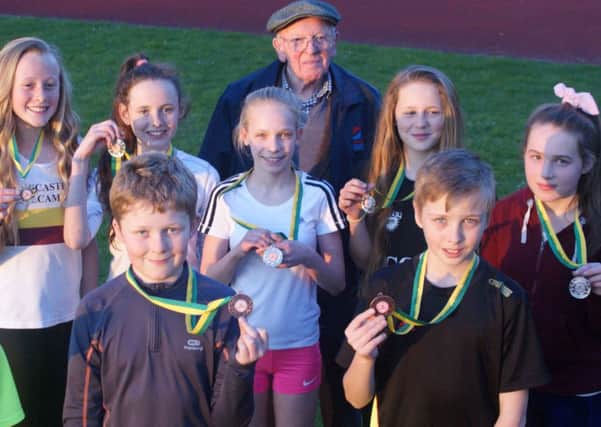 Cross country team medal winners together with club founding member Arnold Bibby. Picture: Charlie Satterley