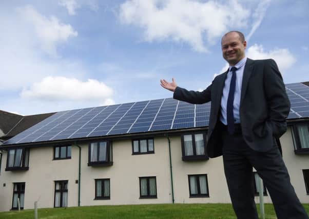 Andy Lemm with the new solar panels at Lancaster House