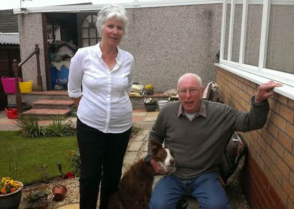 Stan and Winnie Glaves with their rescue dog.